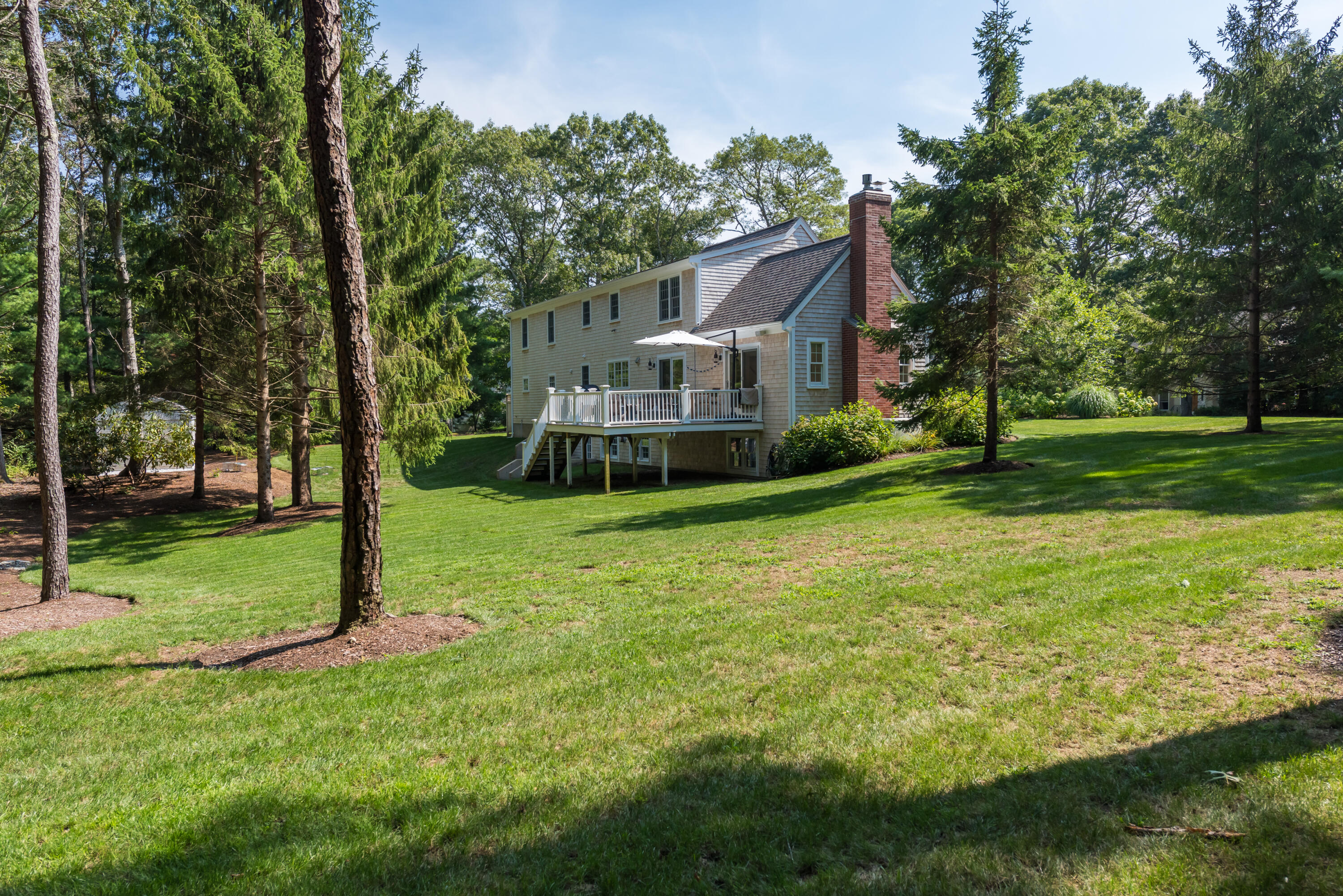 68 Tupelo Road Marstons Mills, MA 02648 - Photo 28 of 29 a view of a house with a big yard and large tree