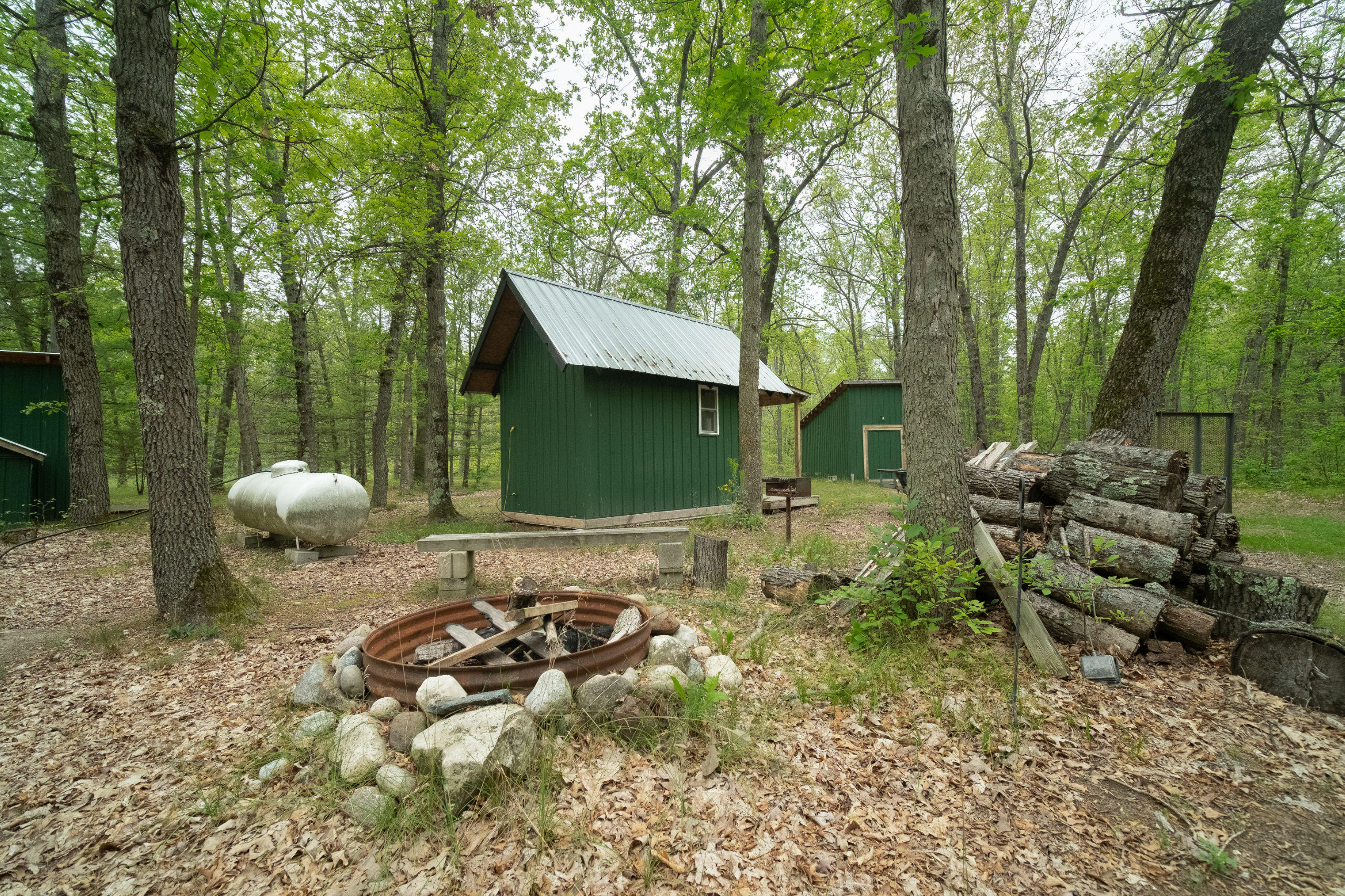 677 Snyder Road Wellston, MI 49689 - Photo 20 of 37 Fire pit for evening gathering