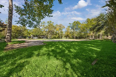 a view of outdoor space with deck and yard