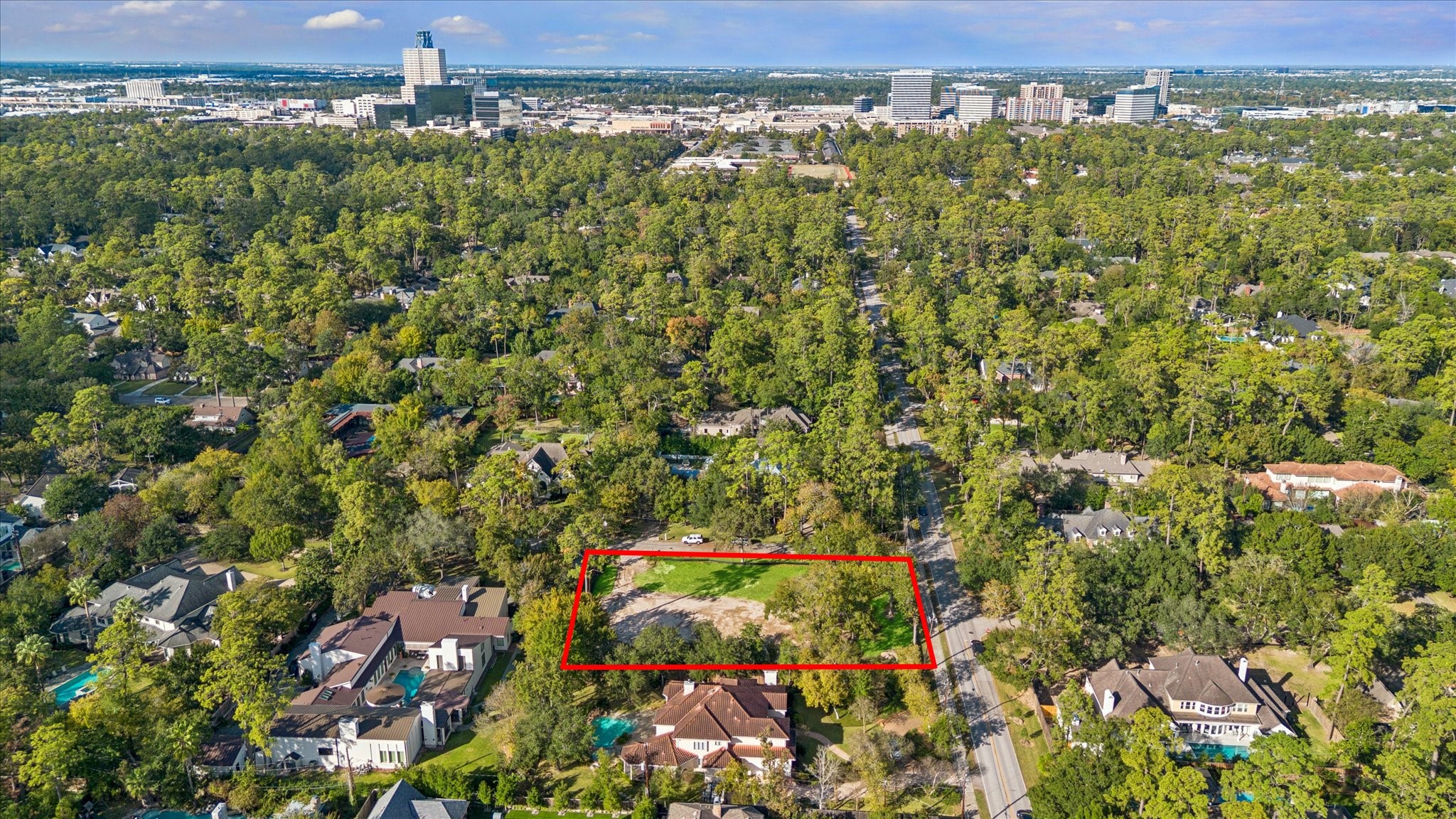 12003 Tall Oaks Street Houston, TX 77024 - Photo 9 of 14 an aerial view of residential houses with outdoor space and trees