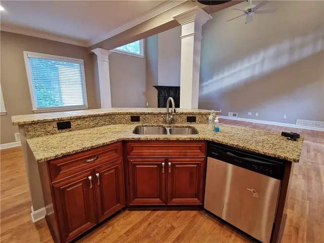 a kitchen with a sink and a stove
