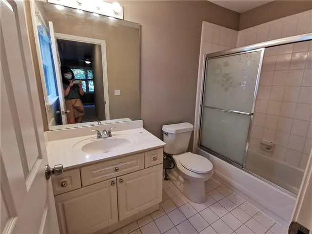 an empty room with a empty space and windows