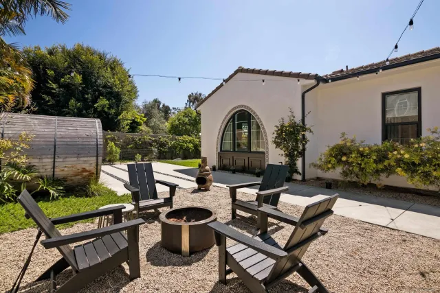 a view of a chairs and table in the patio
