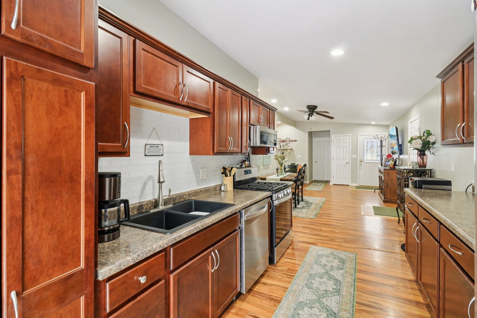 11 Highview Avenue Fox Lake, IL 60020 - Photo 12 of 32 a kitchen with stainless steel appliances granite countertop a sink stove and cabinets