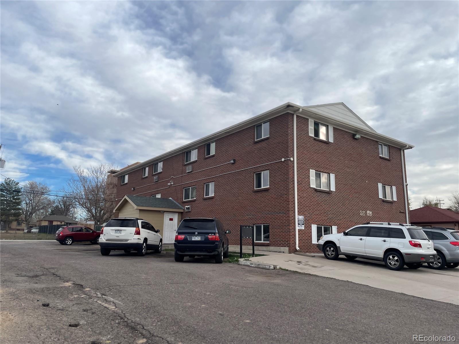 1676 Hanover Street, Unit 304 Aurora, CO 80010 - Photo 11 of 11 a car parked in front of a building