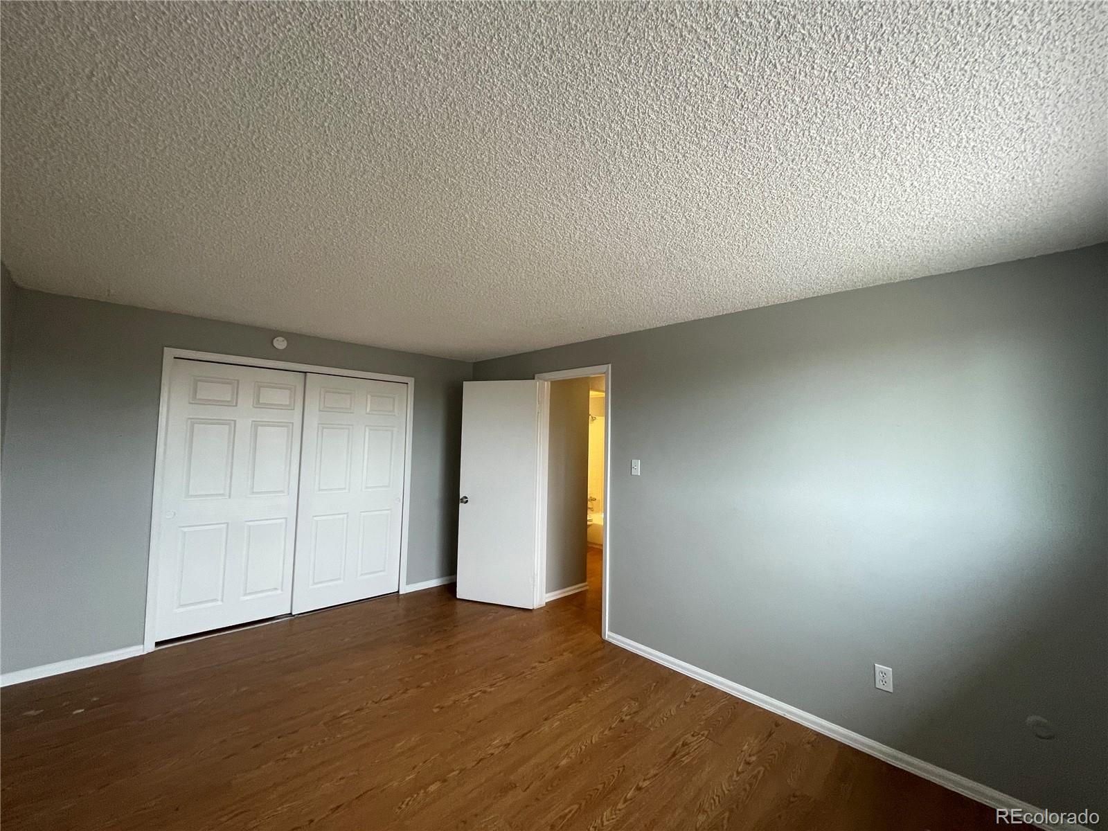 1676 Hanover Street, Unit 304 Aurora, CO 80010 - Photo 8 of 11 an empty room with a window