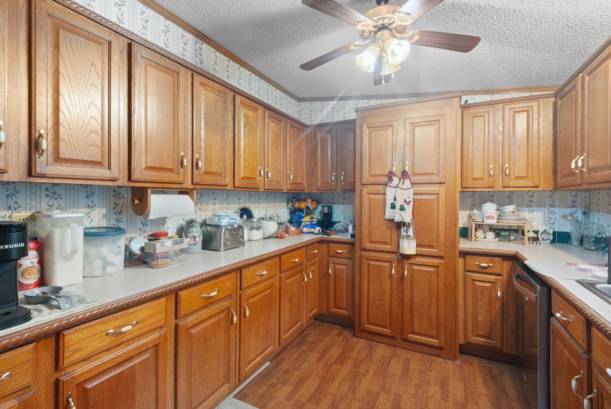 3300 Fishing Ford Road Petersburg, TN 37144 - Photo 18 of 30 a kitchen with stainless steel appliances granite countertop a refrigerator a sink dishwasher and wooden cabinets with wooden floor