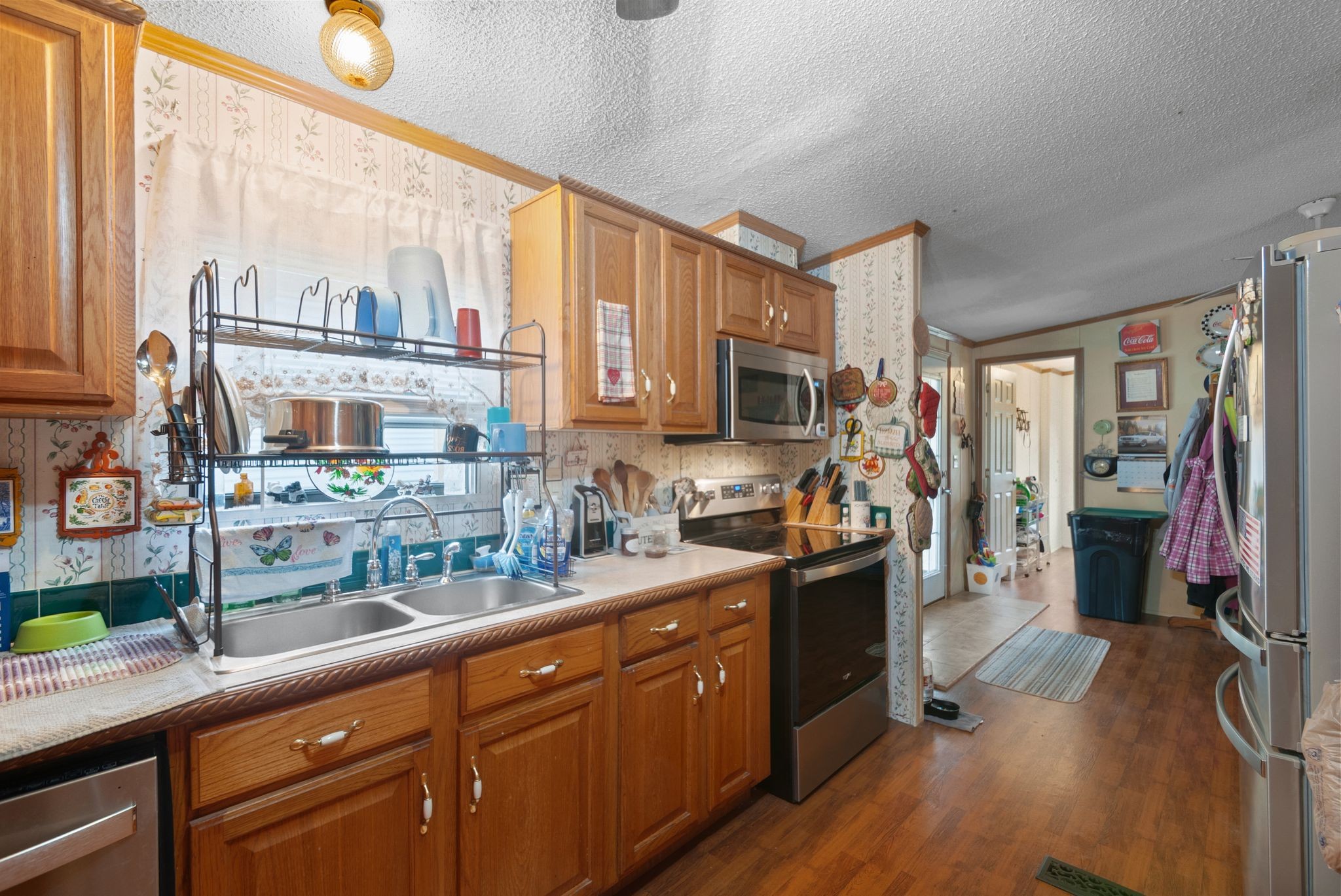 3300 Fishing Ford Road Petersburg, TN 37144 - Photo 19 of 30 a kitchen with stainless steel appliances kitchen island granite countertop a stove a sink a refrigerator and wooden cabinets with wooden floor