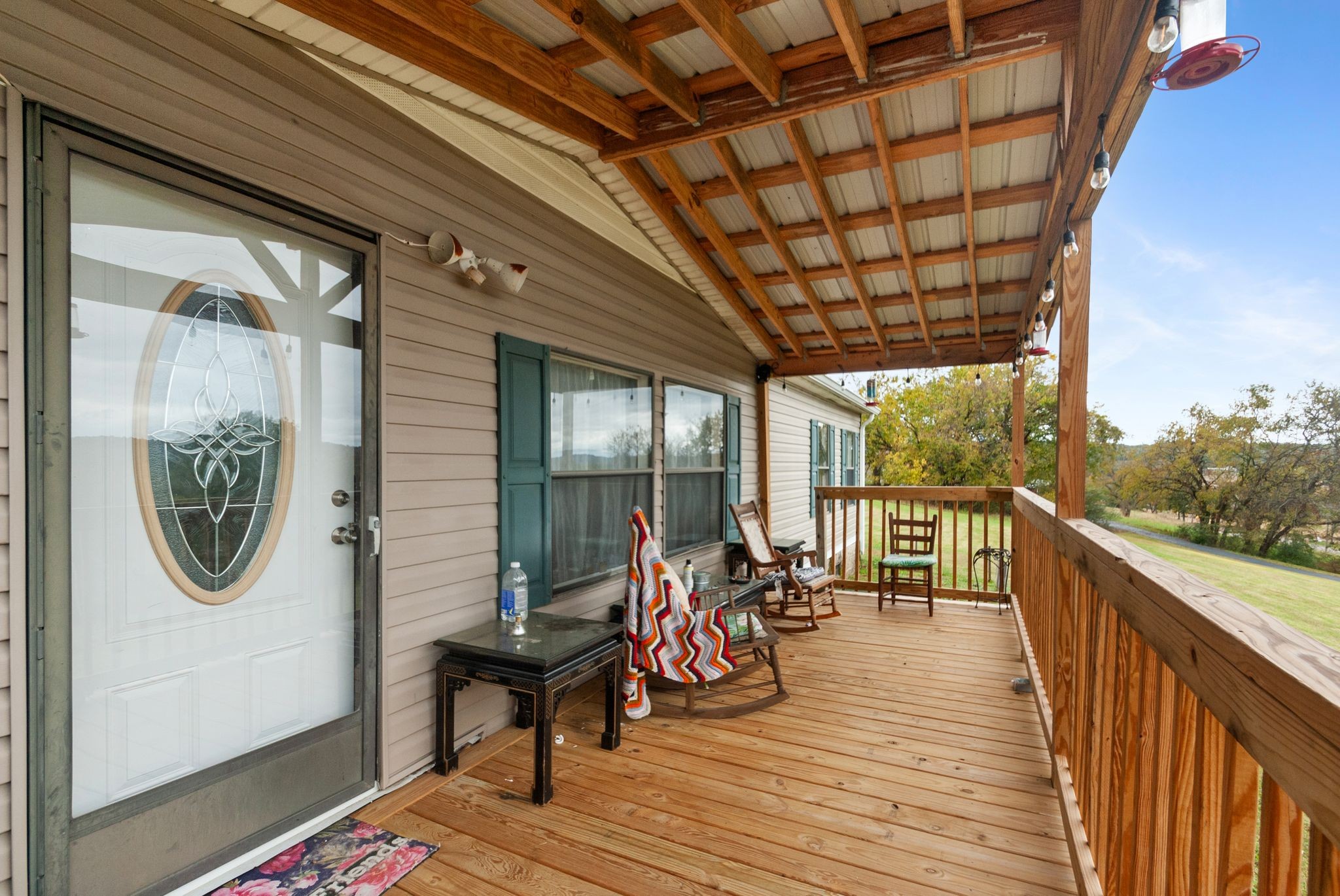 3300 Fishing Ford Road Petersburg, TN 37144 - Photo 4 of 30 a view of a balcony with furniture and wooden floor