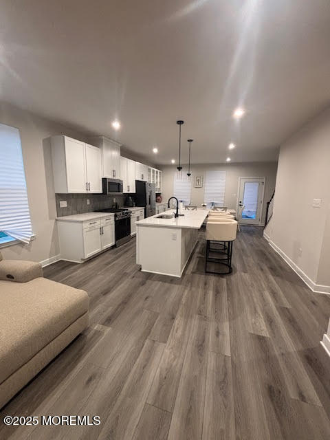 1 Halifax Road Bayville, NJ 08721 - Photo 19 of 45 a living room with a couch and a wooden floor