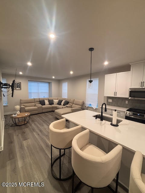 1 Halifax Road Bayville, NJ 08721 - Photo 23 of 45 a kitchen with a sink a stove and chairs