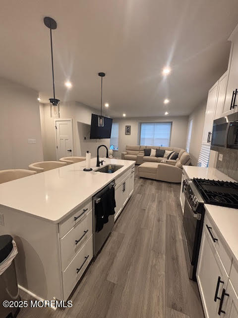 1 Halifax Road Bayville, NJ 08721 - Photo 24 of 45 a kitchen with a stove a sink a refrigerator and chairs