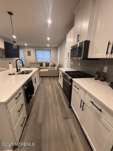 1 Halifax Road Bayville, NJ 08721 - Photo 25 of 45 a kitchen with a sink a counter top space stainless steel appliances and a window