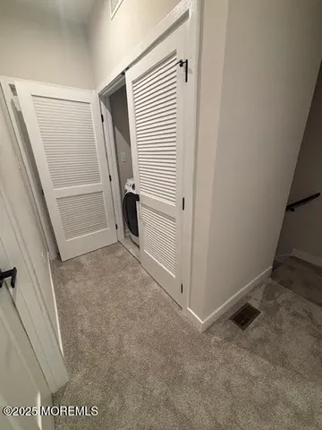 a spacious bedroom with a bed and a window