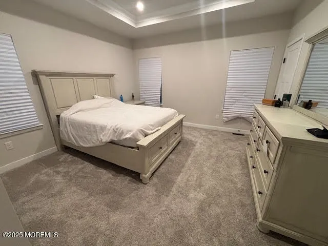 a bedroom with a bed and a mirror