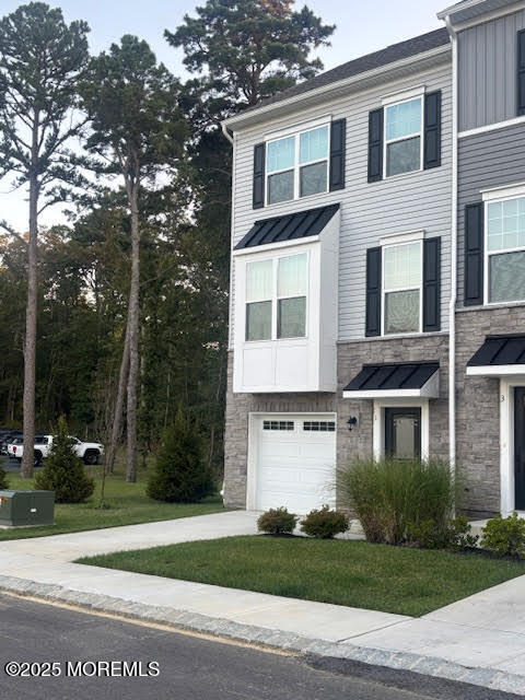 1 Halifax Road Bayville, NJ 08721 - Photo 5 of 45 a front view of a house with a yard and garage