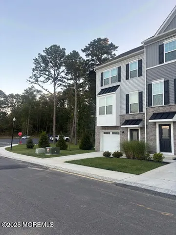 a view of street with tall buildings