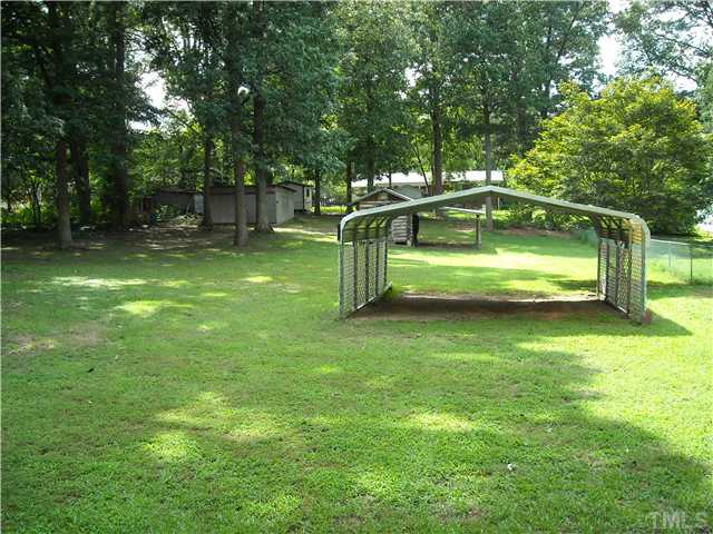 3619 Baugh Street Raleigh, NC 27604 - Photo 4 of 13 Detached Aluminum 2nd Carport: 26'x18', Barn: 14'x10' with 16'x13' lean-to, Metal Workshop Building: 19'x17'