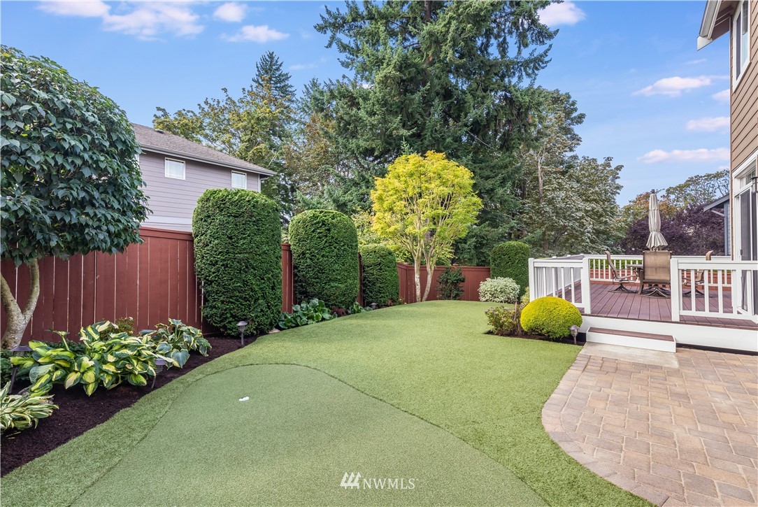 1205 North 27th Place Renton, WA 98056 - Photo 31 of 37 a view of a backyard with plants and a patio