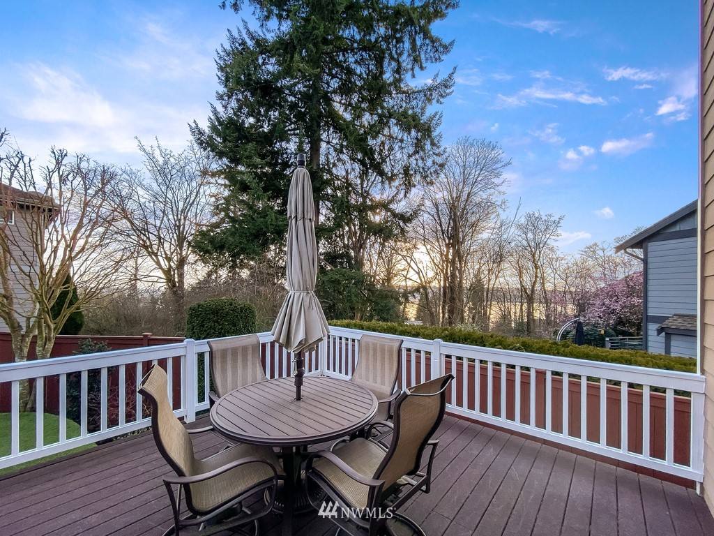 1205 North 27th Place Renton, WA 98056 - Photo 36 of 37 a view of a wooden deck with a bench