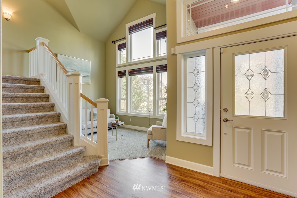 1205 North 27th Place Renton, WA 98056 - Photo 6 of 37 a view of an entryway with wooden floor and door