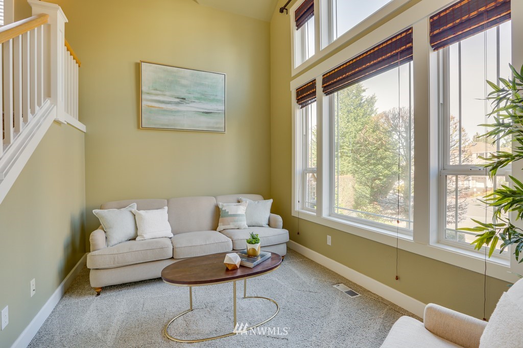 1205 North 27th Place Renton, WA 98056 - Photo 7 of 37 a living room with furniture and a large window