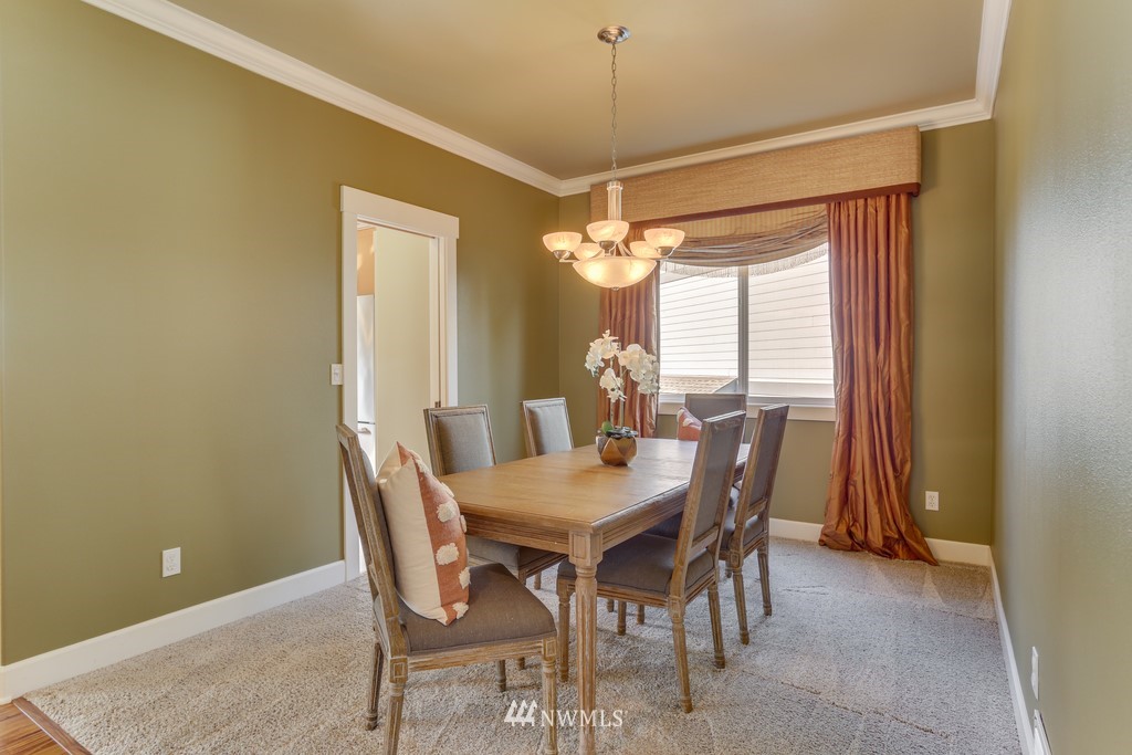 1205 North 27th Place Renton, WA 98056 - Photo 10 of 37 a view of a dining room with furniture and window