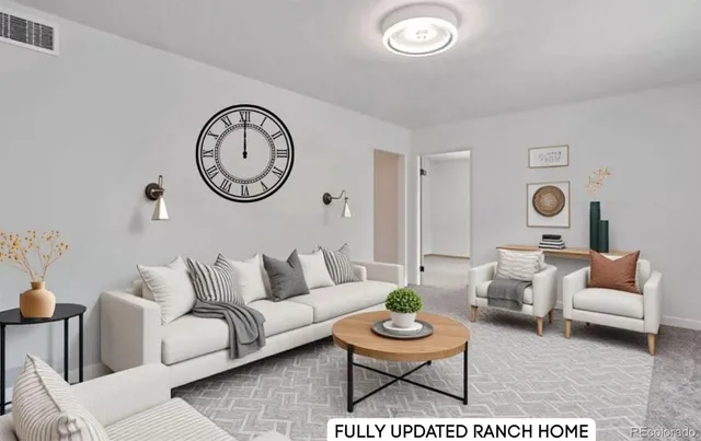 a living room with furniture and a clock