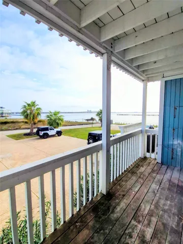 a view of a balcony with ocean view