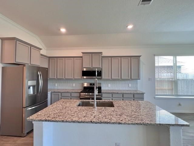4826 Albany Ridge Lane Rosharon, TX 77583 - Photo 12 of 37 a kitchen with stainless steel appliances granite countertop a sink stove and refrigerator