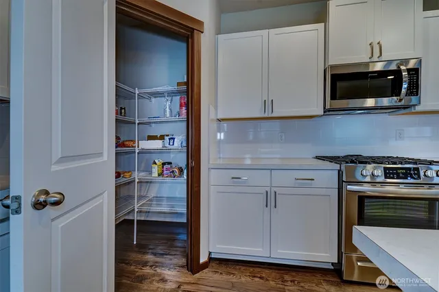 a kitchen with a cabinets and appliances