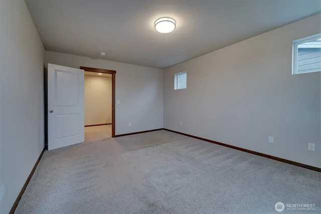 an empty room with a fan