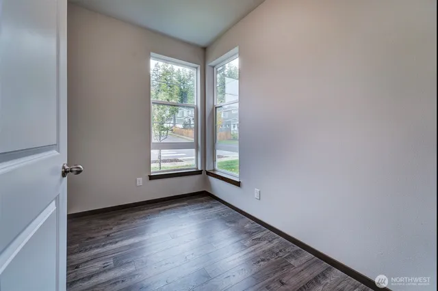 a view of room with window and hardwood