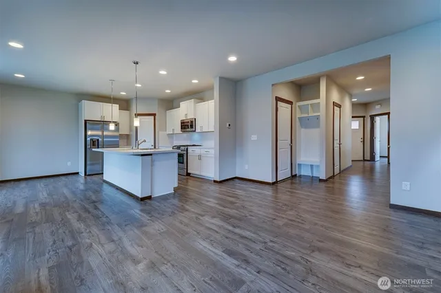 a view of kitchen with wooden floor and windows