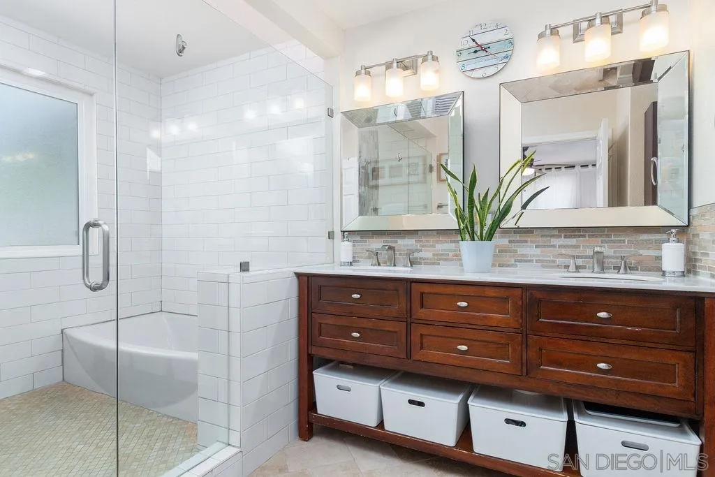 6205 Ruby Lake Avenue San Diego, CA 92119 - Photo 15 of 25 a bathroom with a granite countertop sink a toilet and shower