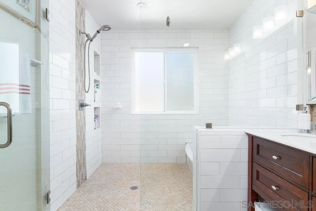 6205 Ruby Lake Avenue San Diego, CA 92119 - Photo 16 of 25 a bathroom with a sink a toilet and shower