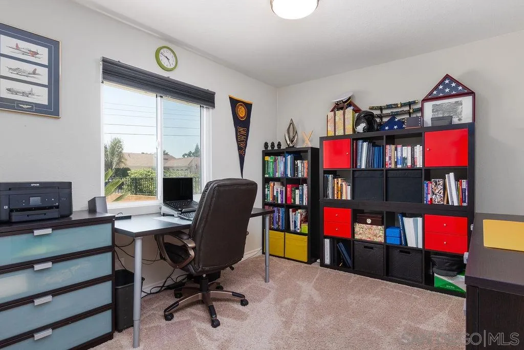 6205 Ruby Lake Avenue San Diego, CA 92119 - Photo 17 of 25 a view of a workspace with furniture and a window