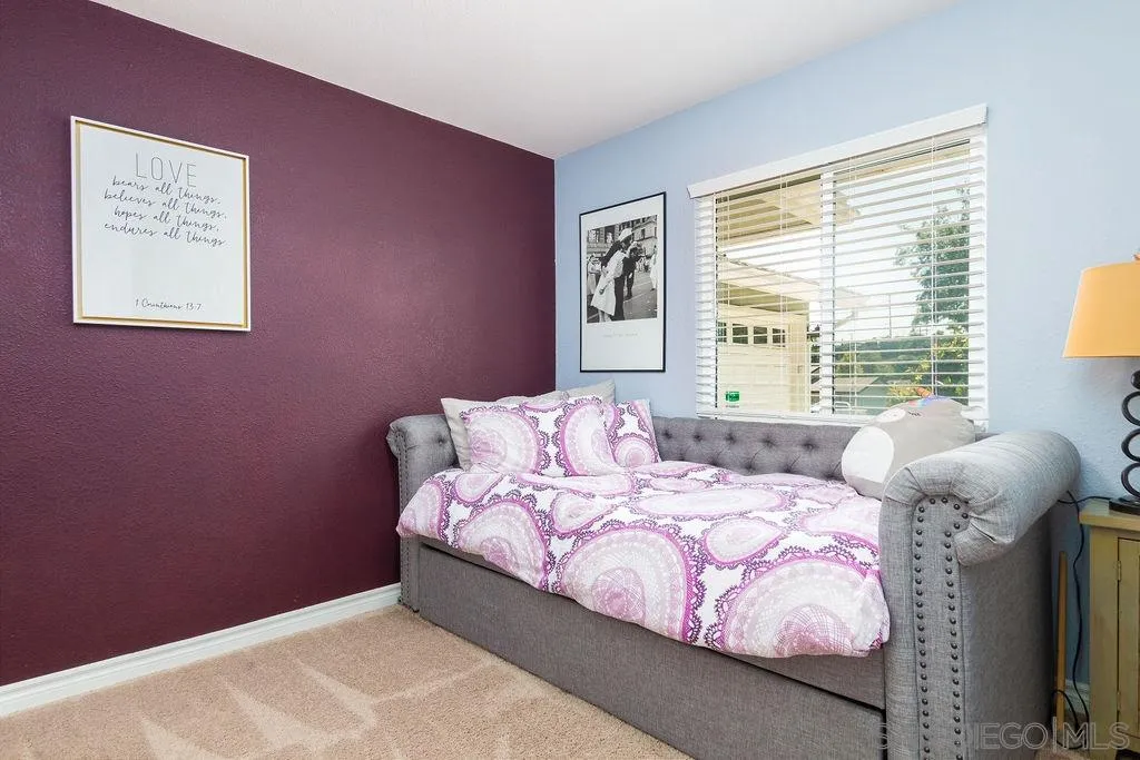 6205 Ruby Lake Avenue San Diego, CA 92119 - Photo 19 of 25 a bedroom with a bed and a window