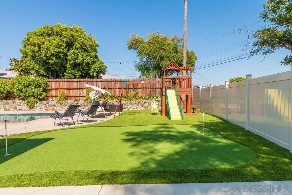 6205 Ruby Lake Avenue San Diego, CA 92119 - Photo 22 of 25 a view of a backyard with swimming pool