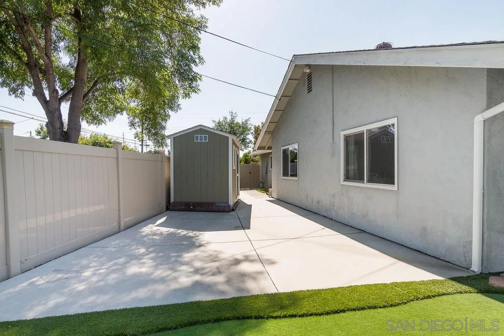 6205 Ruby Lake Avenue San Diego, CA 92119 - Photo 23 of 25 a view of a house with a backyard