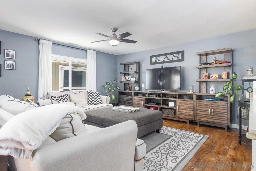 6205 Ruby Lake Avenue San Diego, CA 92119 - Photo 8 of 25 a living room with furniture and a flat screen tv