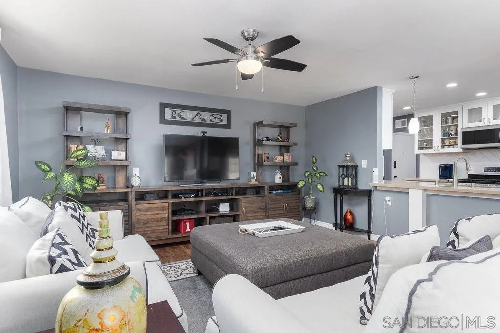 6205 Ruby Lake Avenue San Diego, CA 92119 - Photo 9 of 25 a living room with furniture and a flat screen tv
