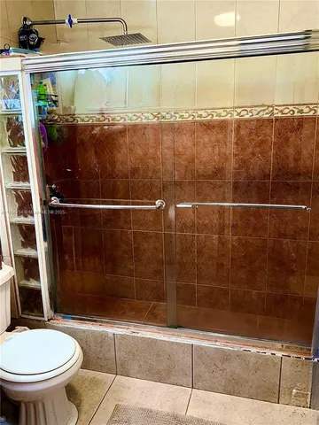 a bedroom with a bed and a desk