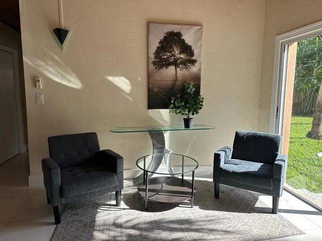 a living room with furniture and a window