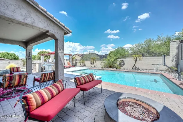 a room with pool table and windows