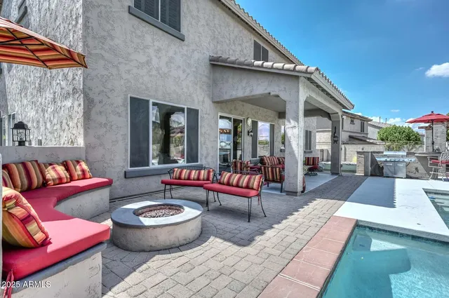a room with pool table and windows