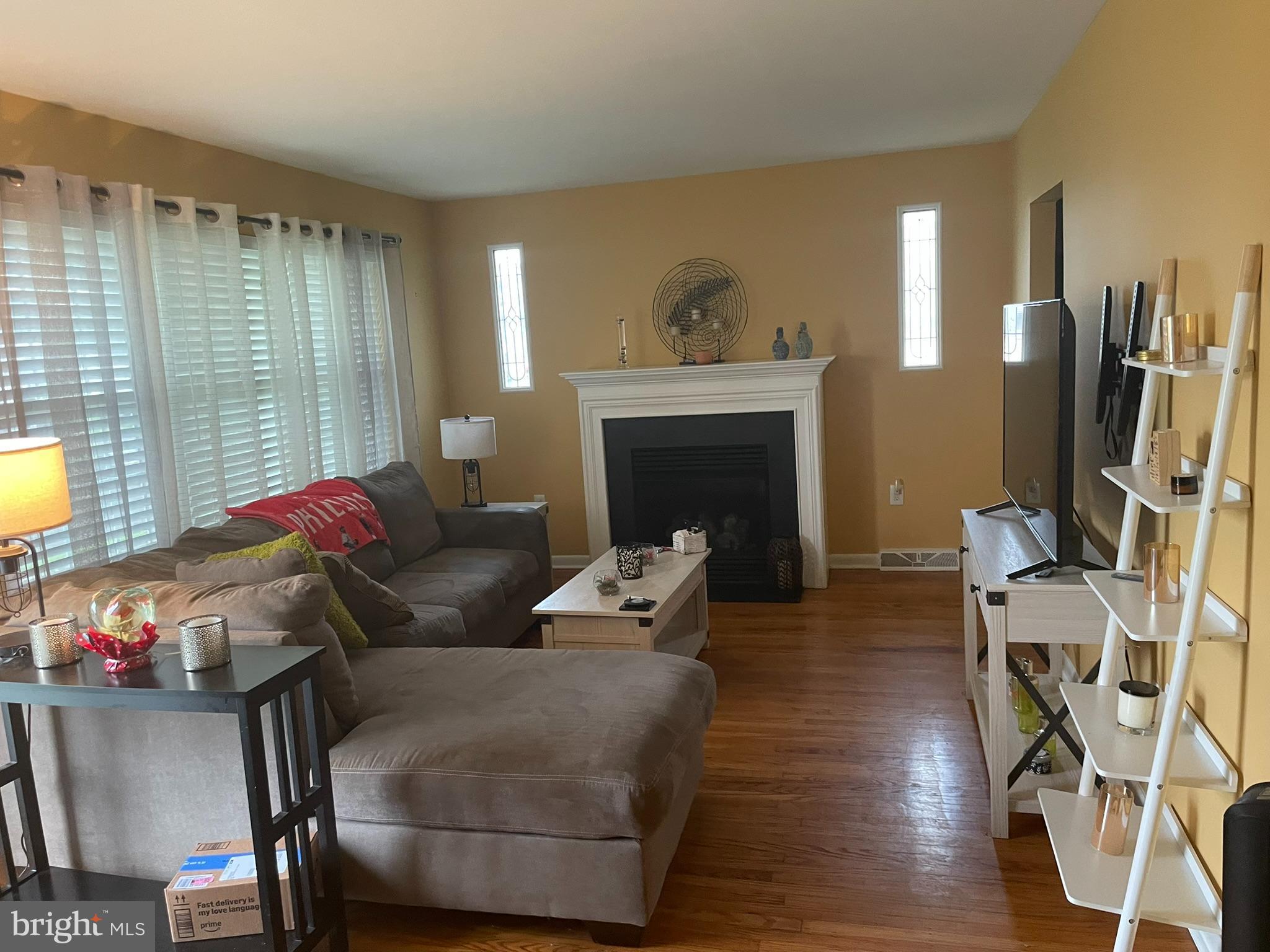 1101 Prospect Lane Somerdale, NJ 08083 - Photo 2 of 41 a living room with furniture a fireplace and a flat screen tv