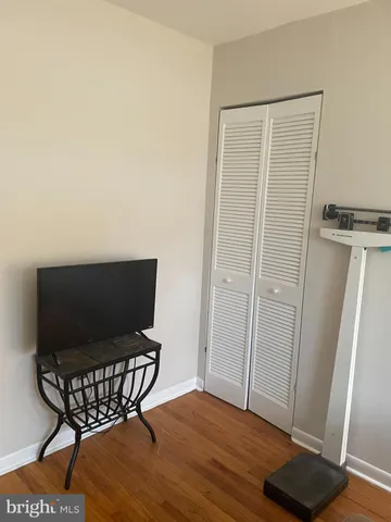 a view of a room with wooden floor and utility room