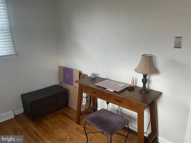 a view of a workspace with furniture