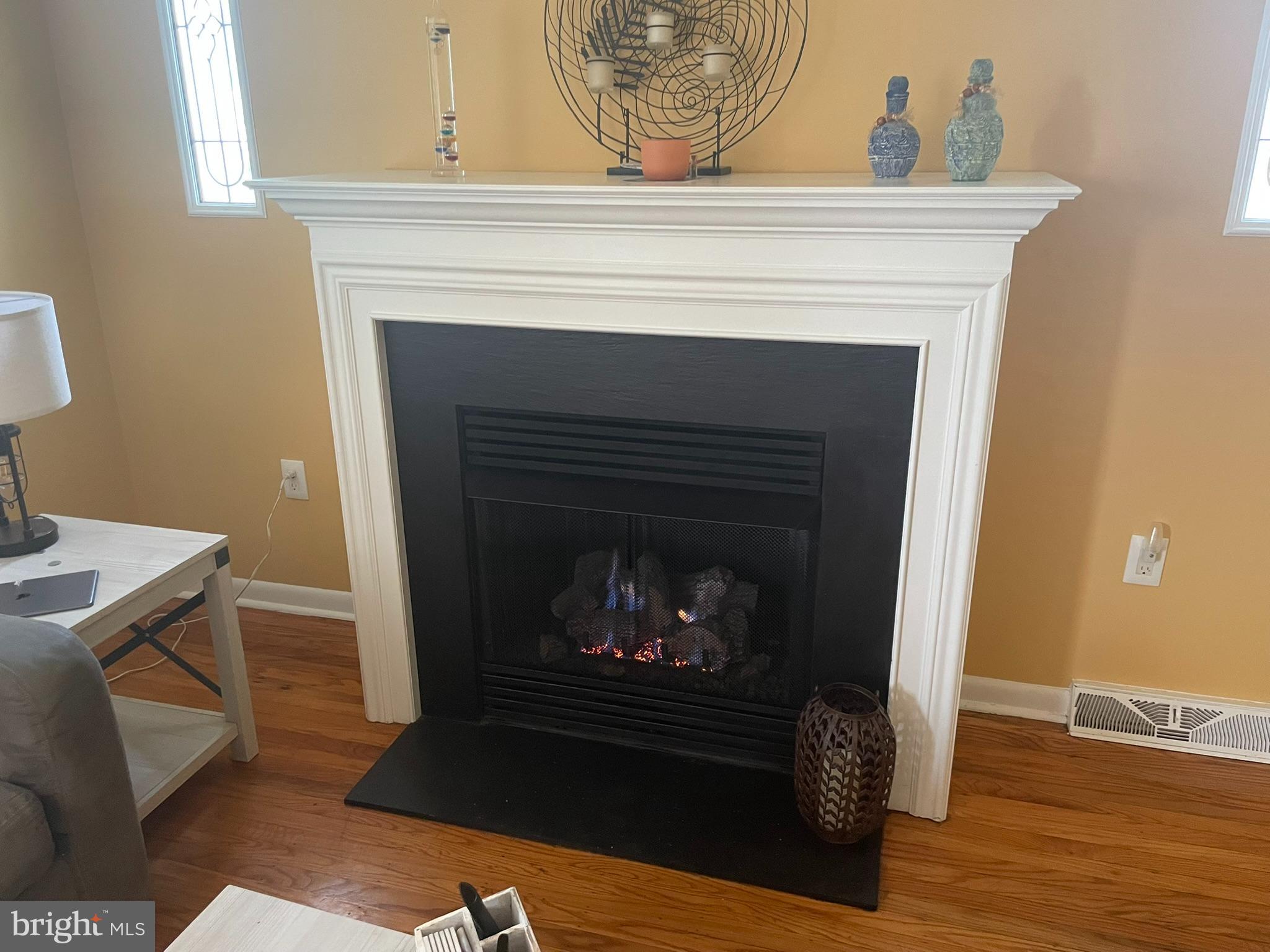 1101 Prospect Lane Somerdale, NJ 08083 - Photo 3 of 41 a living room with a fireplace and a wooden floor